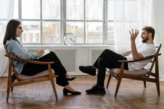 Therapist listening to a patient speak 